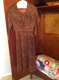 Vintage dress hangs in the antique wardrobe.