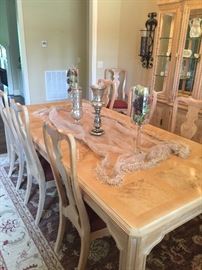 Selling the Dining Room furniture as a set. The Dining Room set is a Corinthians by Heritage. The table is 46" wide and has one leaf that is 22" wide, making the table 8' 2" long when the leaf is inserted. There are six side chairs and 2 arm chairs. Also included in the set is a lighted hutch with glass shelves. Everything has a blonde color. Price for the table, chairs, and hutch: $1,500.