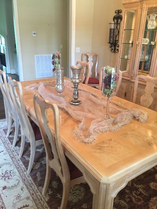 Selling the Dining Room furniture as a set. The Dining Room set is a Corinthians by Heritage. The table is 46" wide and has one leaf that is 22" wide, making the table 8' 2" long when the leaf is inserted. There are six side chairs and 2 arm chairs. Also included in the set is a lighted hutch with glass shelves. Everything has a blonde color. Price for the table, chairs, and hutch: $1,500.