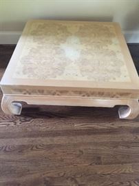 Large square blonde color coffee table with curved feet. The 16" tall table is similar in color to the dining room table. Price: $75.