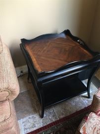This is a black tray table with a wood top. It has a lower shelf, removable tray top and a classic look. The table is 28" square and 28" tall. Price: 150