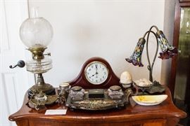 Antique Kerosene Lamp:  $120.00. Crystal Votive:  $12.00. Brass Nuevo Ink Well:  $60.00. Mantle Clock:  $30.00.  Inlaid Desk Set:  $90.00.  Milli Fiori Lily Lamp:  $60.00. Oval Noritake:  $8.00