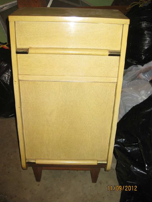 This slant front 50's blond night stand has a twin!  Plus the entire bedroom set is here too!  Pictures coming soon.  And it's in very good condition.