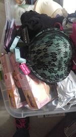 Lots of containers full of new bras panties and shapewear