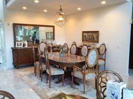 ABSOLUTELY BEAUTIFUL AND OVER THE TOP ANTIQUE DINING ROOM SET. MARBLE TOP TABLE AND THE SET HAS 12 CHAIRS, MATCHING BAR, SIDEBOARD, 2 BOMBE CHESTS AND MATCHING OCCASIONAL TABLES. SEE ALL PICTURES BELOW