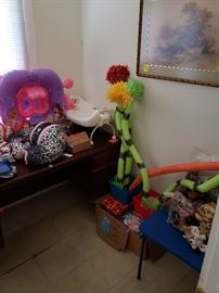 Behind the Dr Seuss party supplies and baby stuff is a regular desk we still have for sale Monday.