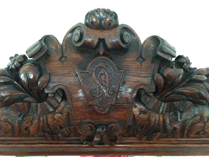 Detail of the carving detail on the antique oak mirror. 