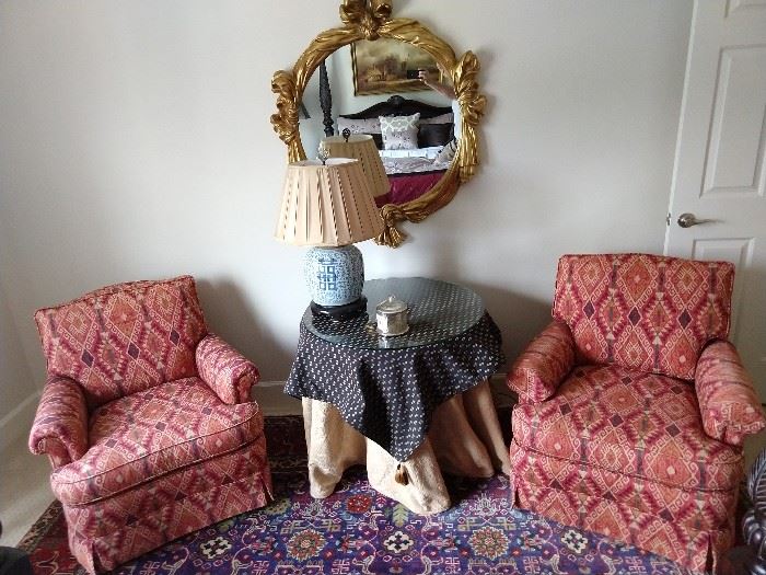 There's a softer side to the Jungle Room, with this pair of upholstered armchairs, by Jessica Charles. Gilt wood wall mirror, vintage Asian blue/white porcelain ginger jar table lamp.