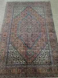 Vintage Persian bijar rug, hand woven, 100% wool face, measures 7' x 10'.