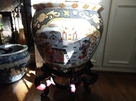 Large Asian porcelain fishbowl on mahogany stand.