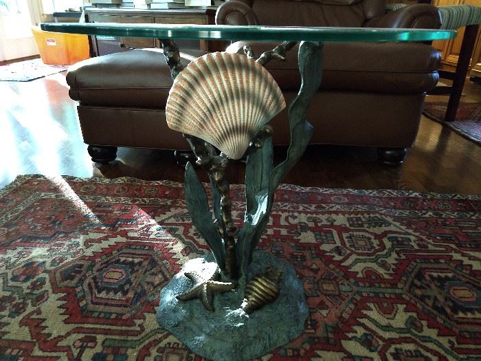 Cool seaside-inspired metal coffee table, with glass top. 