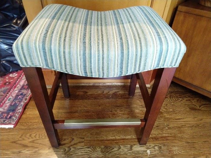 Pair of striped linen upholstered low barstools.