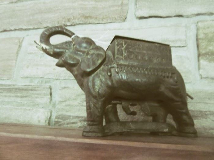 The elephant is an early cigarette server.  Cigarettes go in top and twist of the tail makes cigarette fall from bottom.