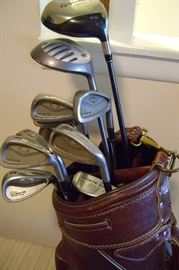 Another leather golf bag with high end clubs...