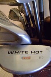White Hot putter is one of the many clubs in this bag.