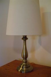 Brushed brass Stiffel lamps with white shades.