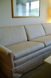 Like new retro mid-century couch was slip covered for many years.  Couch measures 94 inches by 31 deep.