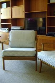 A pair of Danish styled side chairs with seat and back cushions.  The solid teak wall unit measures 48 inches wide by 67 inches tall.  Both units side by side measure 8 feet wide.  Spectacular flawless 1960's Scandinavian teak furniture. 