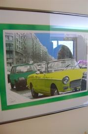 The colorful Paris FIAT's are matted and framed and the piece measures 20 by 16. 