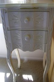 Antique 2-drawer painted end table is perfect the way it is or it could be refinished.  Stands 29 inches tall.