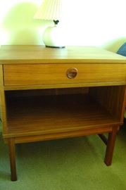 A pair of bedroom Danish teak night stands.  Each stands 25 inches tall with 1-drawer and 1-shelf.