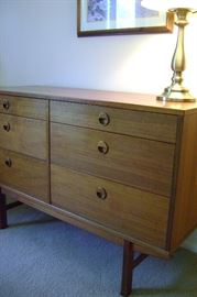 Teak bedroom chest of drawers or credenza/sidboard measure 48 inches wide by 18 deep and 31 inches tall.  Showroom quality from many years ago.
