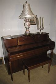 This is one view of the Wurlitzer upright piano, with a candelabra and lamp on top.  