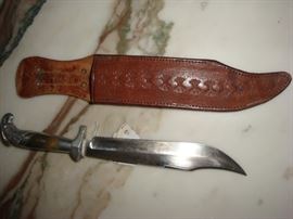 View of knife blade and belt scabbard