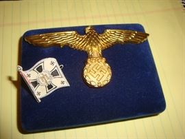 Kreigsmarine pith helmet badge in great shape and a small plastic pin.