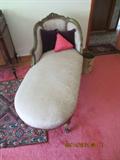 fainting couch from the 1900s with a down feather cushion