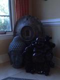 Two Budha statues and one replica of an antique rice barrel lid