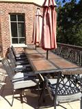 Two outdoor dining sets, each table seats six, bronze aluminum frames with tile inserts on the table