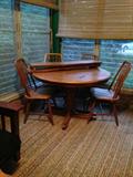 Amish Oak Dining Room Table with four chairs and leaf