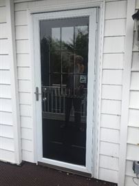 Storm door Nickel hardware and fiberglass/9 window solid Entry door includes solid brushed nickel hardware. $250. Solid glass storm/screen door- $100.  80 X 32 Door must be secured after removed with plywood. 