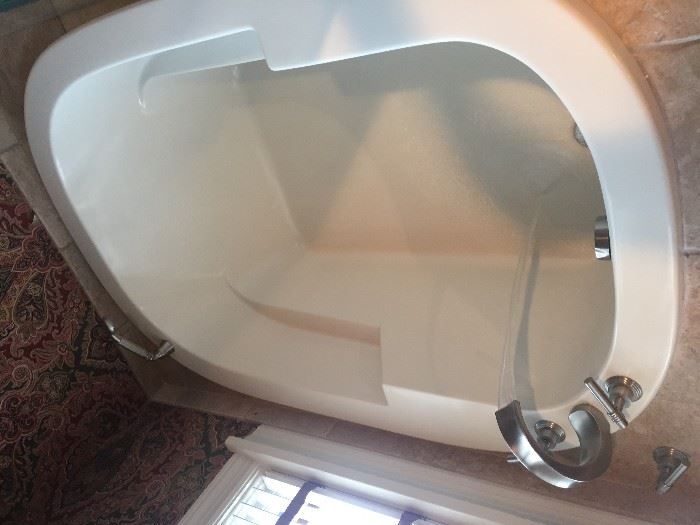 5 ft. X 35" White soaking tub with waterfall faucet and handheld shower.  $400 