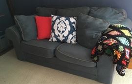 Loveseat which comes with legs (we just chose to take them off.) Legs sold with the loveseat. Pillows and afghan for sale as well. This area rug is for sale, too.