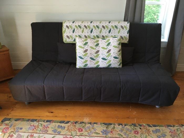 Awesome IKEA full-sized futon which has barely been used.  The futon comes with this grey cover, a mattress pad, and all pillows.  The comforter on the back and matching pillow are also for sale.  