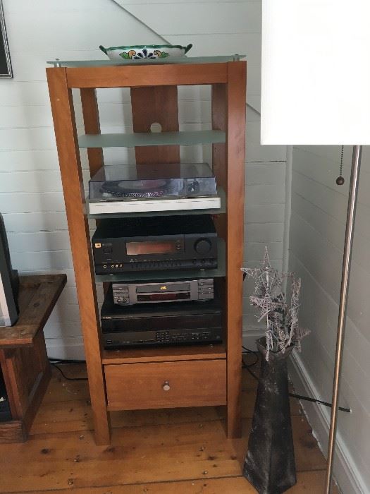 Media center and all stereo equipment on it are for sale, separately or as a whole package.  The large vase next to the media center is for sale as well. 
