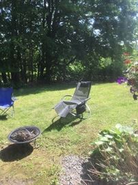 Awesome outdoor rocker/lounge chair and firepit are available.
