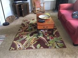 Beautiful Company C rug for sale! In this photo, couch, rocker, and pie safe are also for sale. The coffee table is for sale, the African basket and pottery are not for sale.