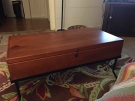 Coffee table matches end table (see photo.) The top lifts up and there's plenty of storage for remotes, etc...Great matching piece!