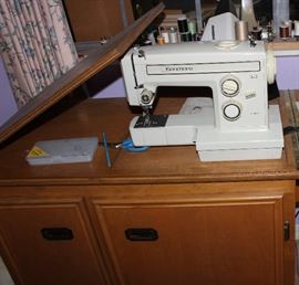 Kenmore swing machine with cabinet