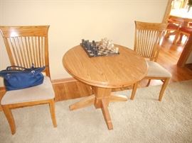 36" round game size table with mission style influenced chairs.  