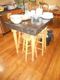 Granite covered Kitchen Island, beautiful condition , nice size . And hardwood stools available.