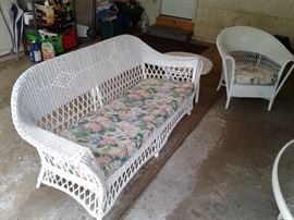 Vintage wicker  sofa and chair. In very good condition for its age. Plus small round table.