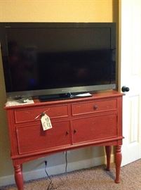 Red Ashley Chest/Cabinet and  a  Sony Bravia 40" Flat Screen TV