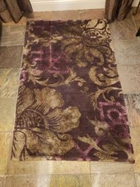Plum wool and silk gorgeous rug purchased new from Hagopian for $1,200 available for $700; 58" x 36"; one of our favorite rugs; very rich looking!