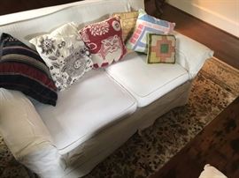 Slipcovered loveseat.