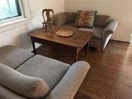 vintage sofas with antique farm table AND a child's chair.