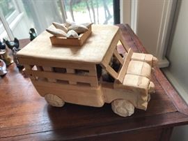 Carved wooden bus. Naive but charming. Great detail.